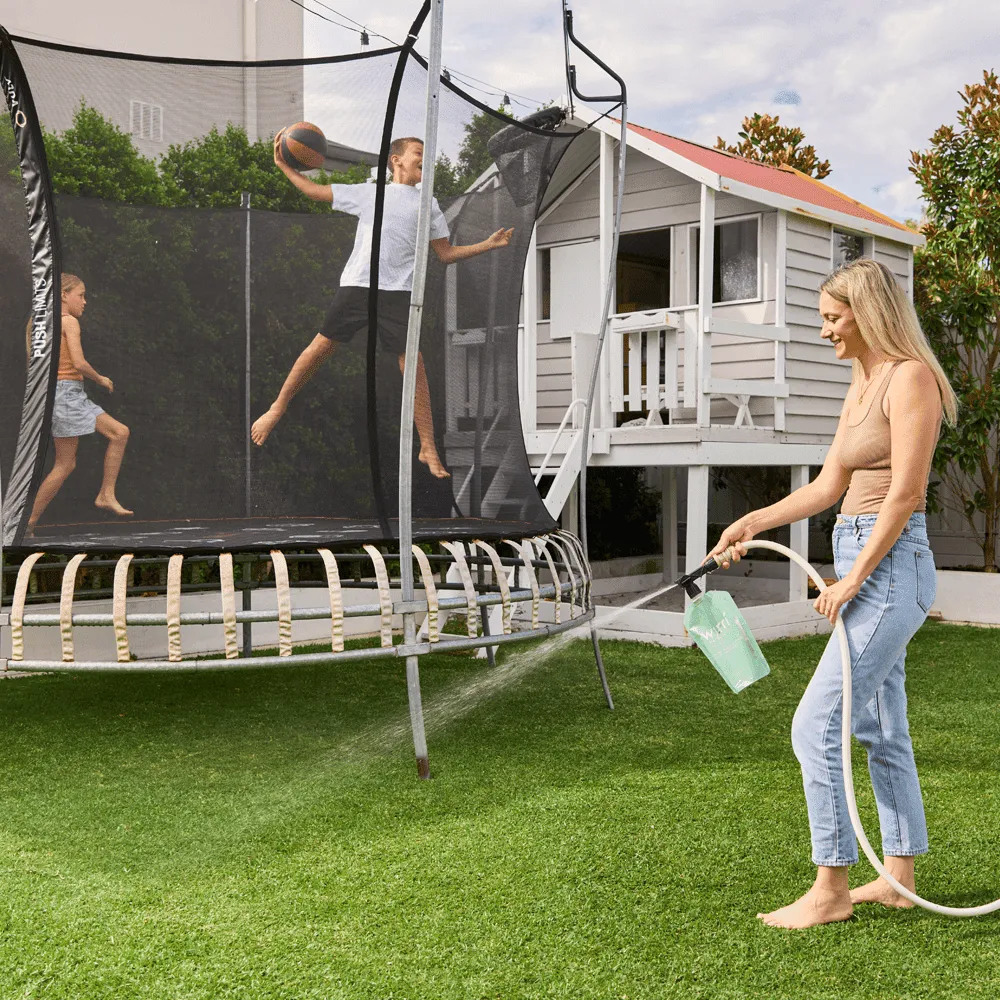 Sustainable-gardening-solutions-Woman-using-lawn-products