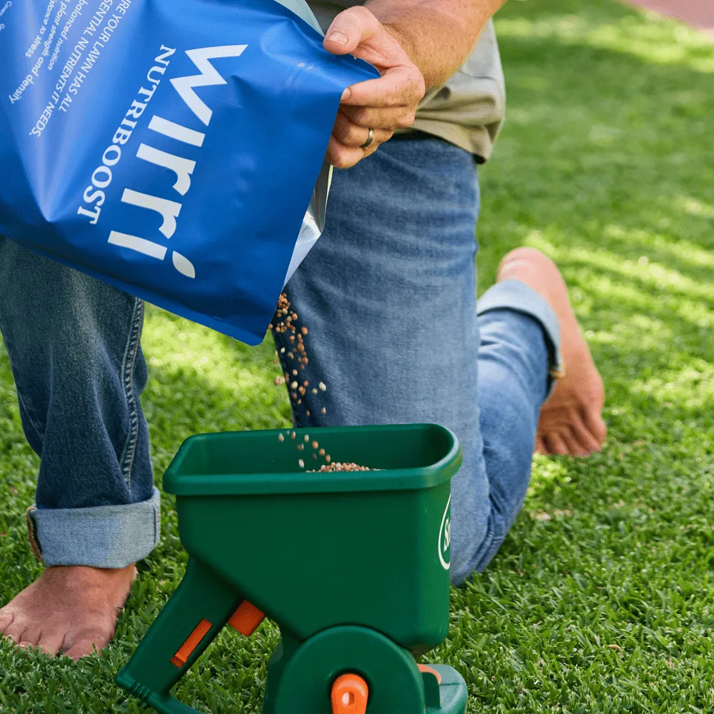 Australian-Lawn-Care-Man-setting-granular-fertiliser-in-container